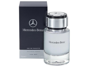 Duftflakon vor schwarzer Verpackung